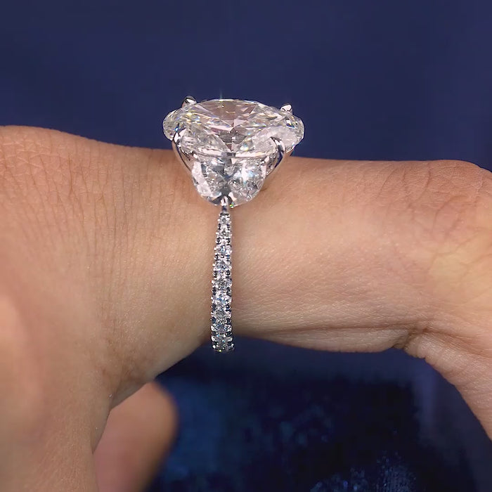 oval engagement ring with tapered shank ring.
