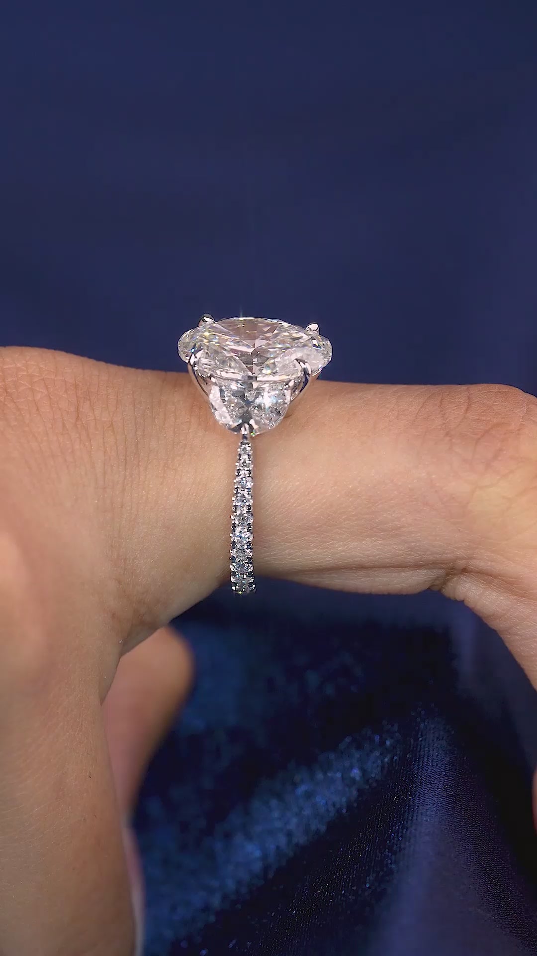 oval engagement ring with tapered shank ring.
