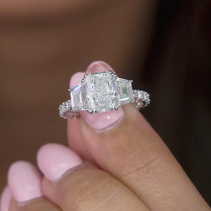 trapezoid side stone with pave setting ring.

