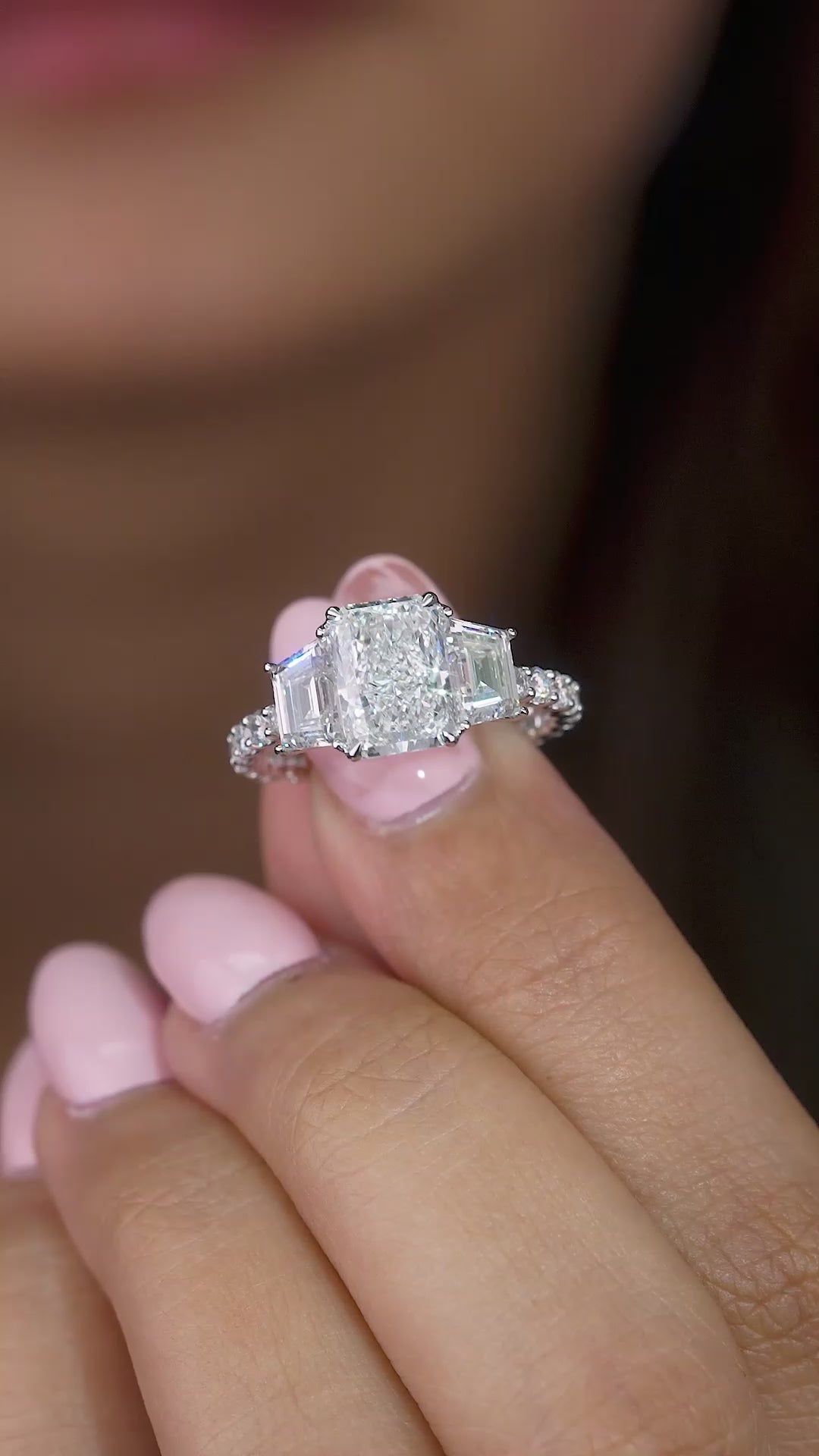 trapezoid side stone with pave setting ring.
