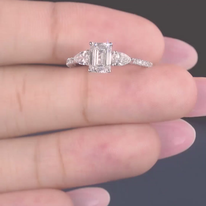 Emerald Cut Engagement Ring on trilogy engagement ring.
