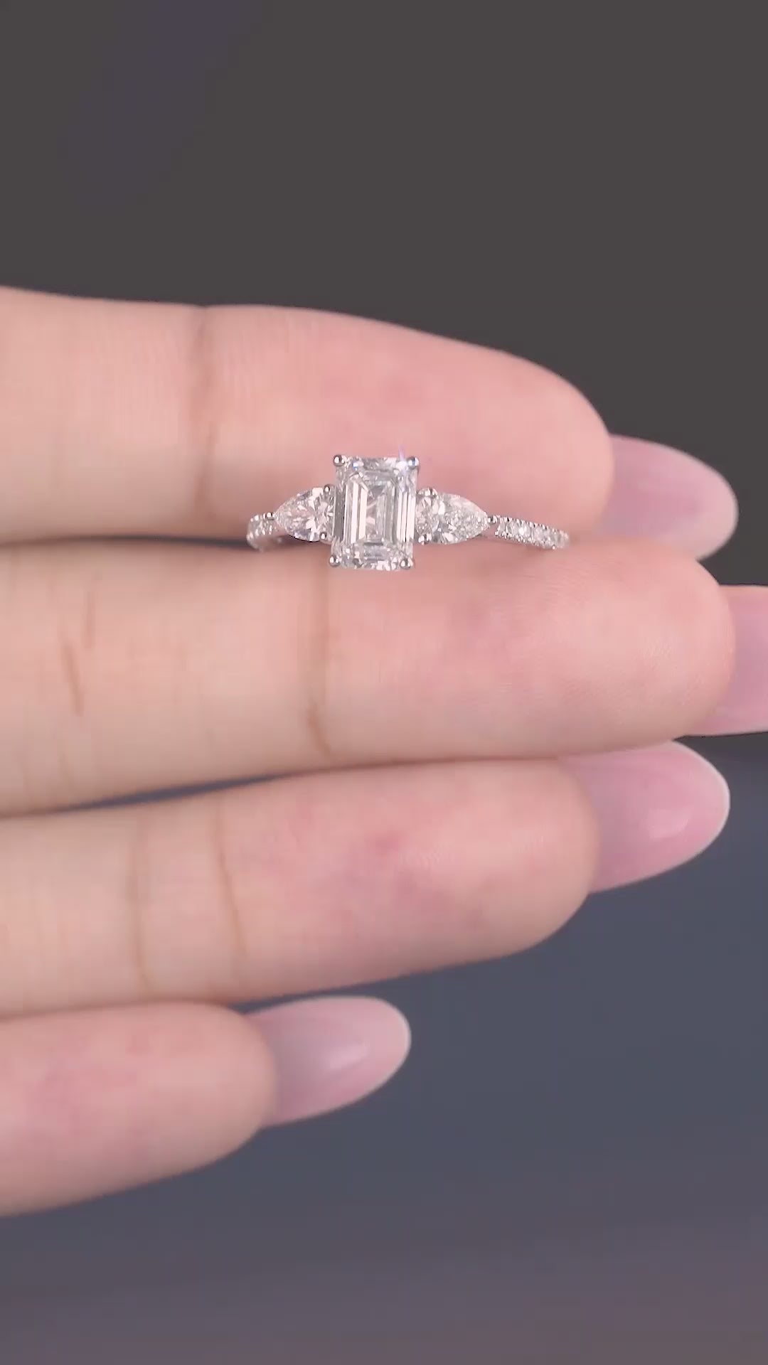 Emerald Cut Engagement Ring on trilogy engagement ring.
