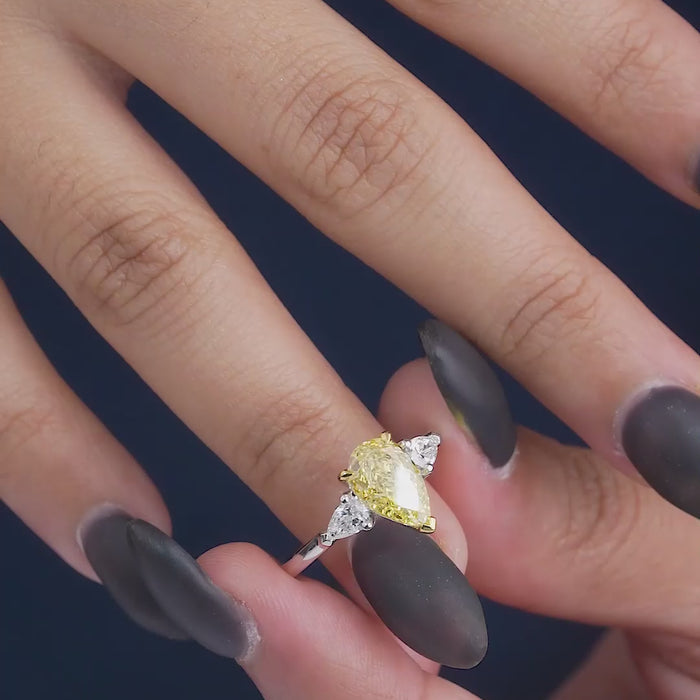pear cut engagement ring on three stone ring.
