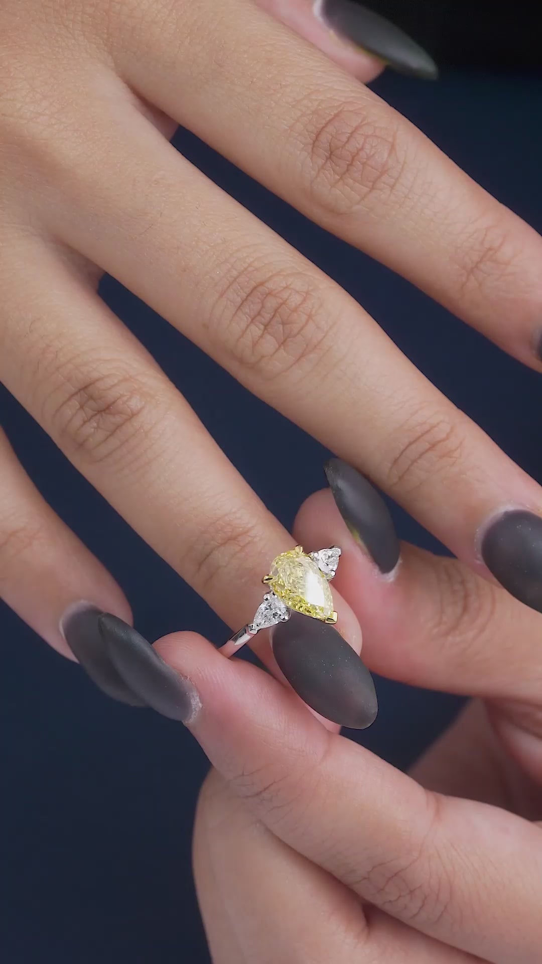 pear cut engagement ring on three stone ring.
