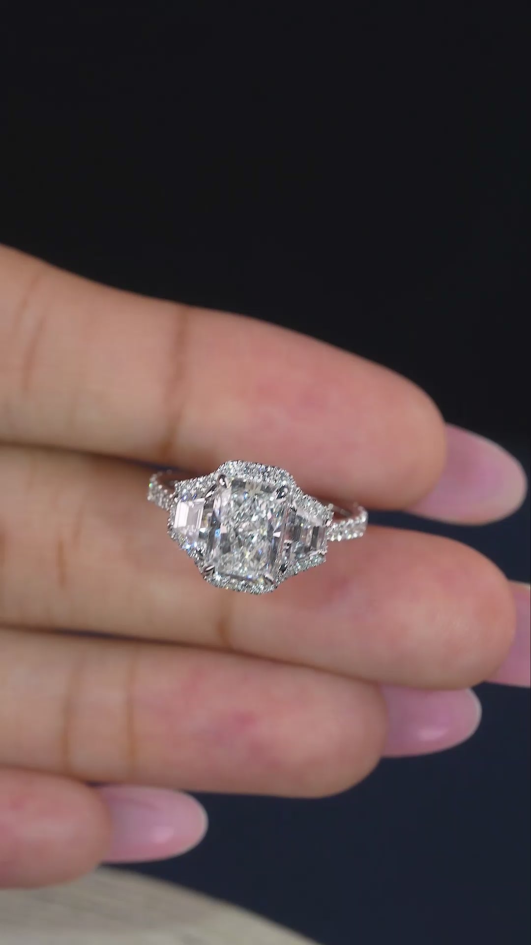 radiant cut engagement ring on unique ring style.
