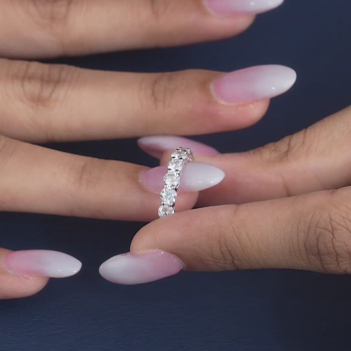 round diamond wedding band on shared prong setting.
