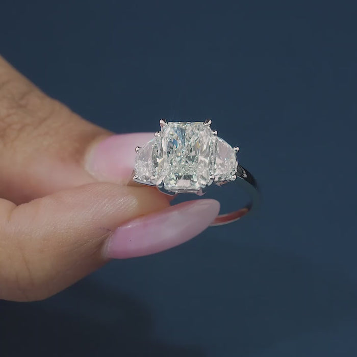 radiant cut diamond ring on solid gold engagement ring.
