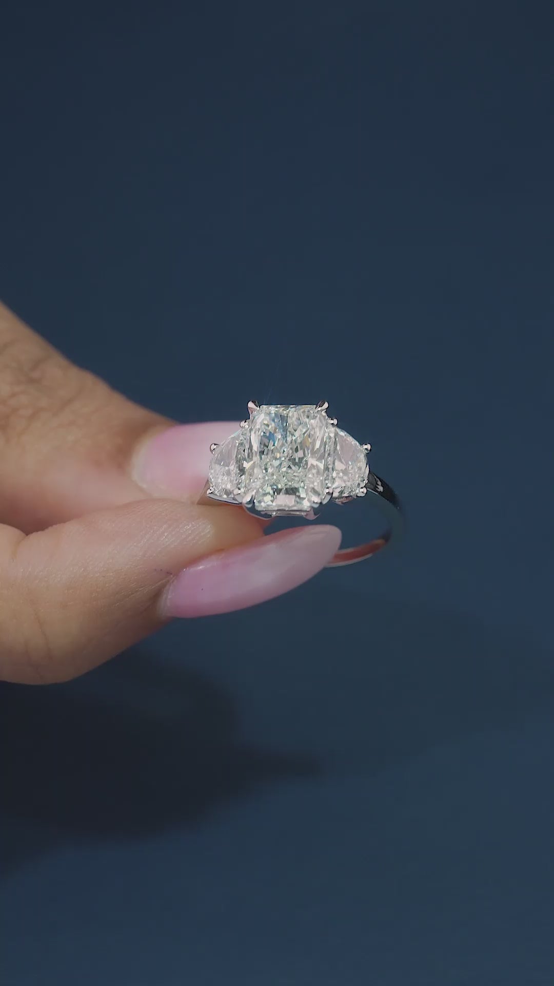 radiant cut diamond ring on solid gold engagement ring.
