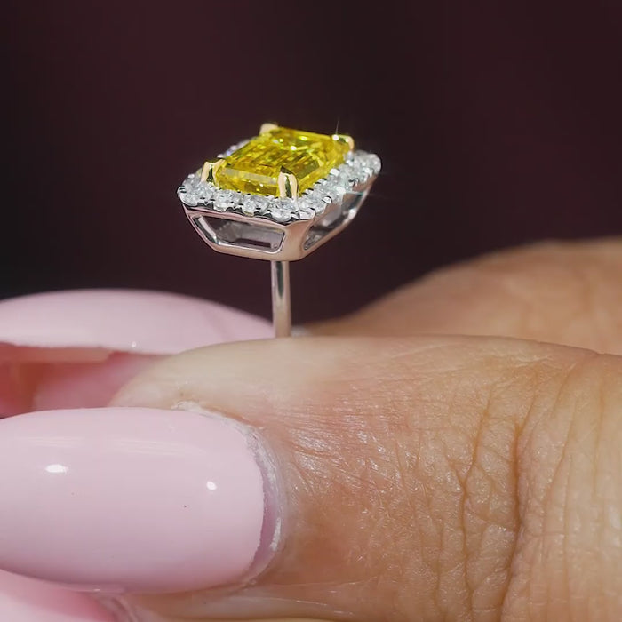 emerald cut diamond earrings with halo setting.

