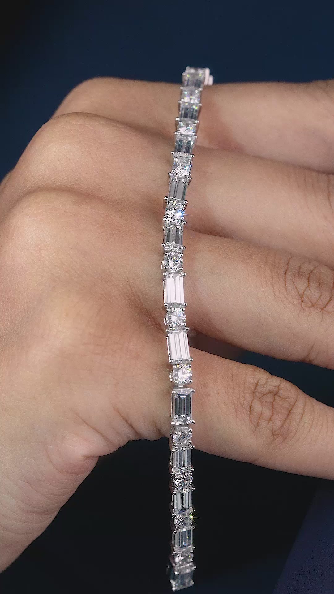 round diamond tennis bracelet with box lock bracelet.
