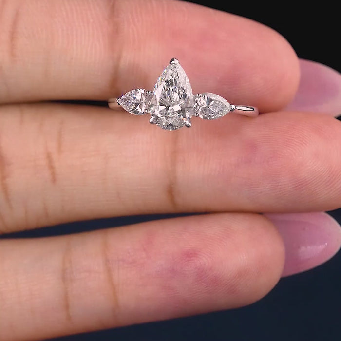 three stone diamond ring on trilogy ring.

