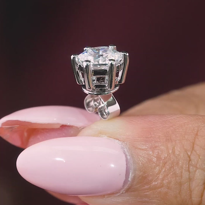 hexagon solitaire earrings with basket setting.
