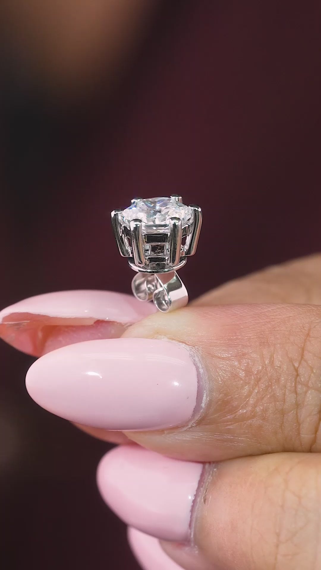 hexagon solitaire earrings with basket setting.
