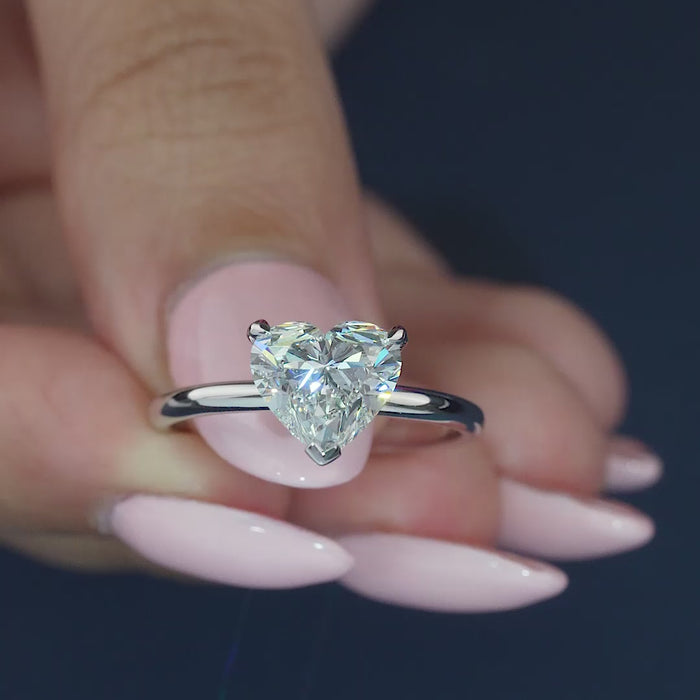 3 prong setting on solid gold engagement ring.
