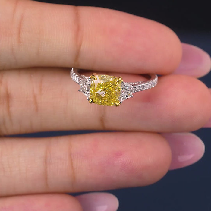 pave diamond ring with cushion cut with trapezoid side stones.
