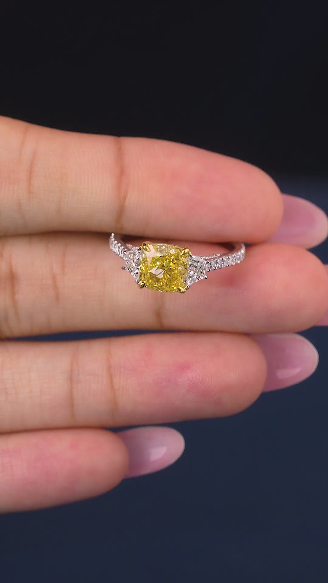pave diamond ring with cushion cut with trapezoid side stones.
