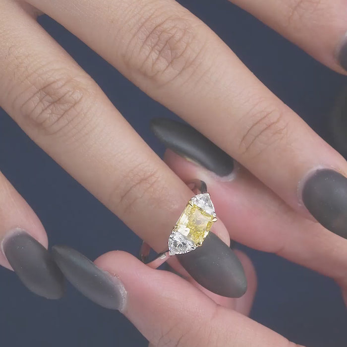 yellow diamond engagement ring on two tone ring.

