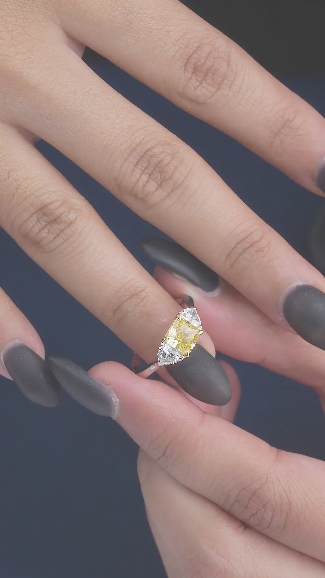 yellow diamond engagement ring on two tone ring.
