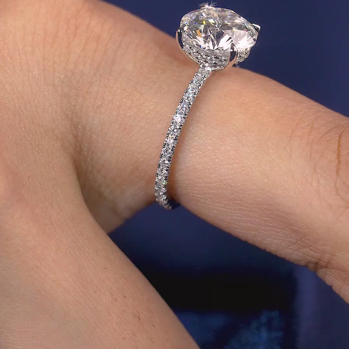hidden halo ring with elongated cushion engagement ring.