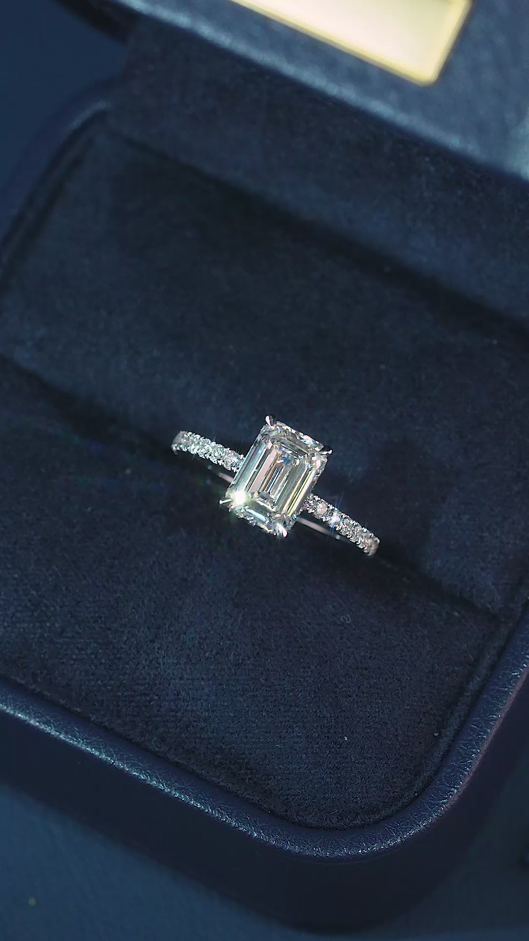 Emerald diamond engagement ring with Hidden halo engagement ring.